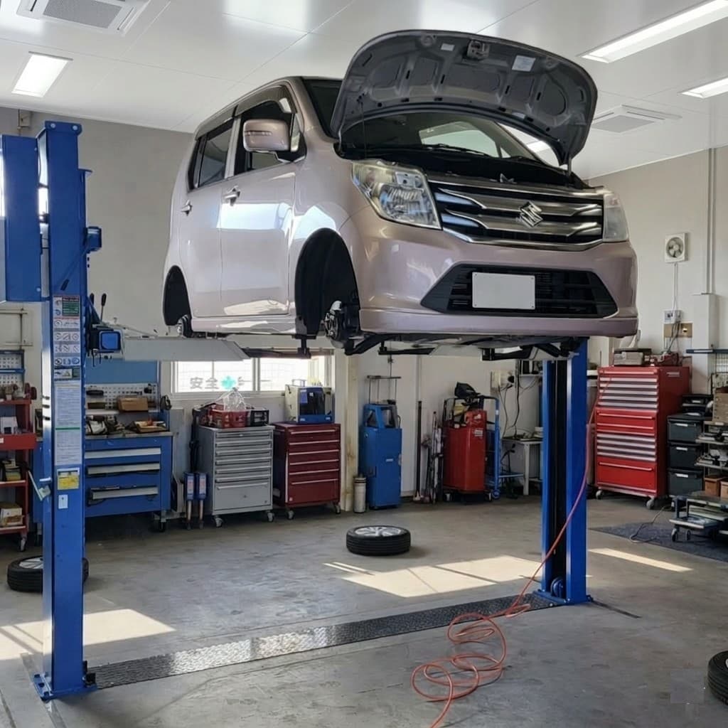 リフトで整備中のお客様のお車と認証工場の設備